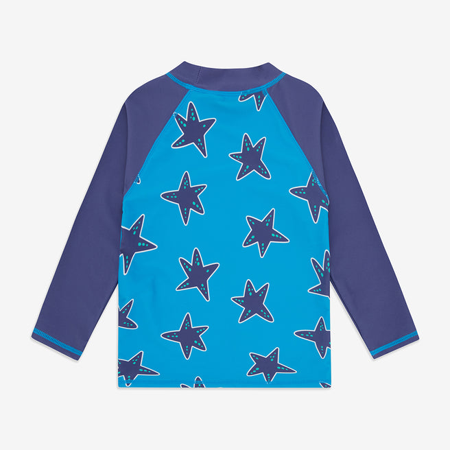 UV Protective Rash Vest Blue Starfish, back view, a blue shirt with navy blue sleeves and starfish pattern on the front panel.